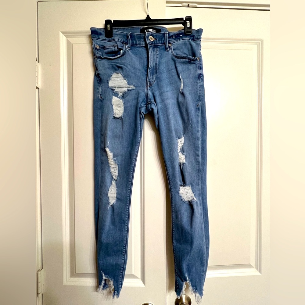 Distressed Mid Rise Skinny Jeans